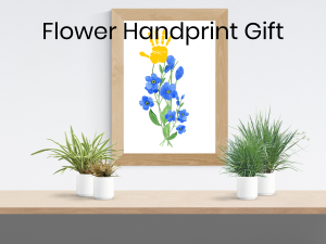 Framable art work with forget me nots and a painted handprint