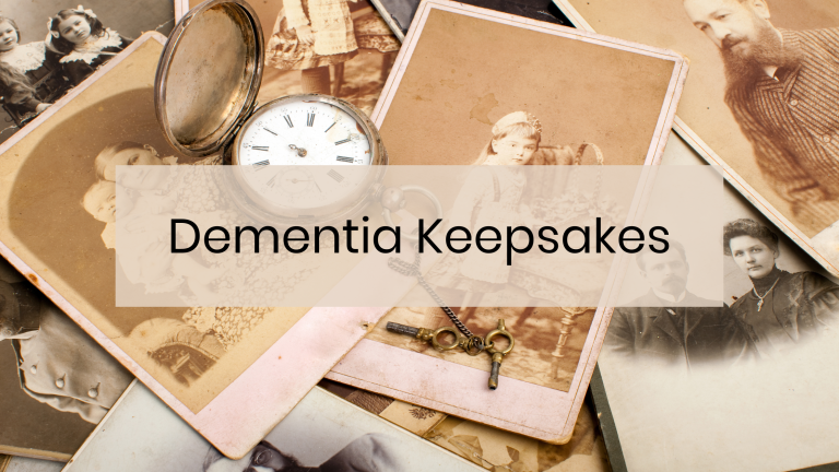 Faded photo keepsakes of ancestors with an old pocket watch