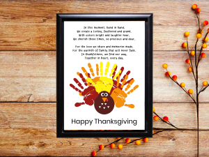 Completed art project dementia keepsake showing painted handprints, a poem and the words Happy Thanksgiving