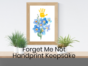 Framable keepsake with a bouquet of forget me nots and a painted handprint
