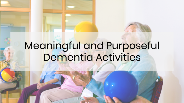 Group of seniors sitting in chairs with exercise balls in their hands